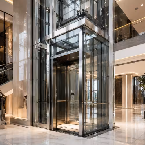 Modern glass elevator inside a luxury commercial building designed for premium vertical mobility by TheNova Elevators