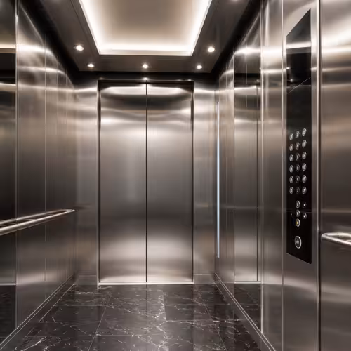 Modern luxury elevator cabin interior with stainless steel walls and soft LED lighting by TheNova Elevators